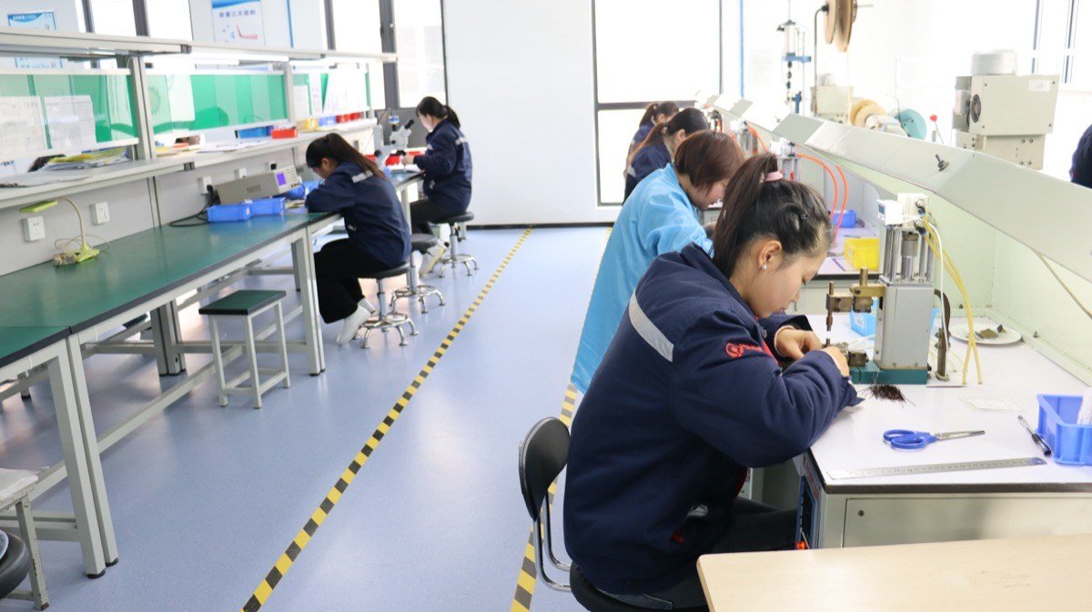 Endotec production team assembling endoscope components in clean room facility